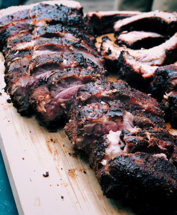 A perfect rack of smoked pork ribs with smoke ring